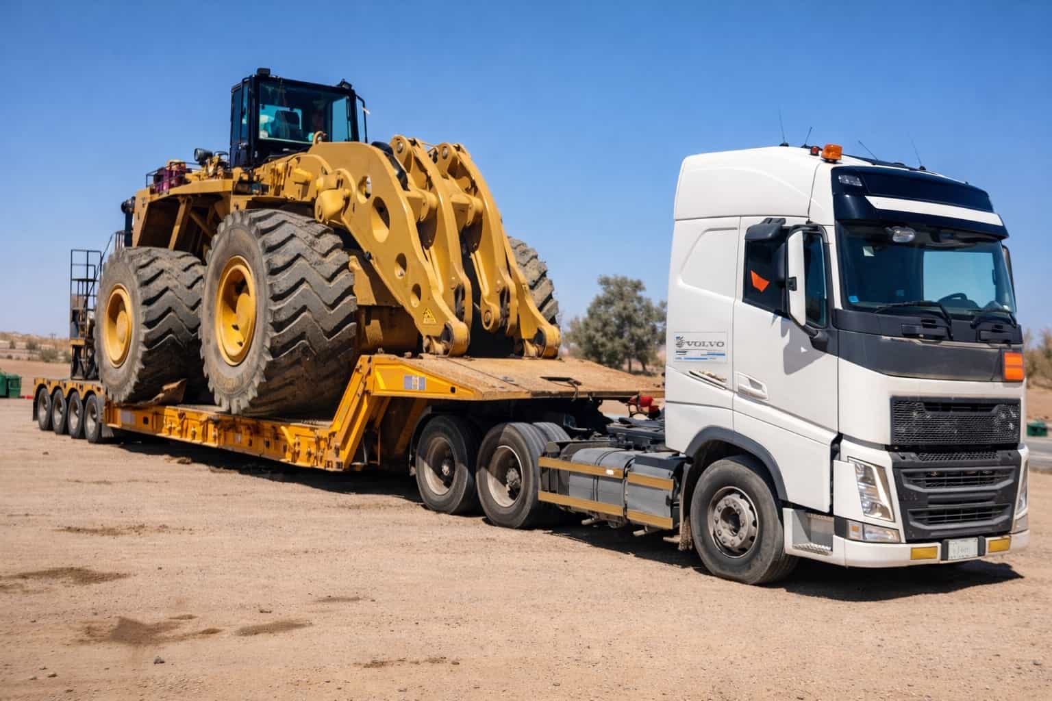 Excavator on lowbed trailer — heavy machinery transport